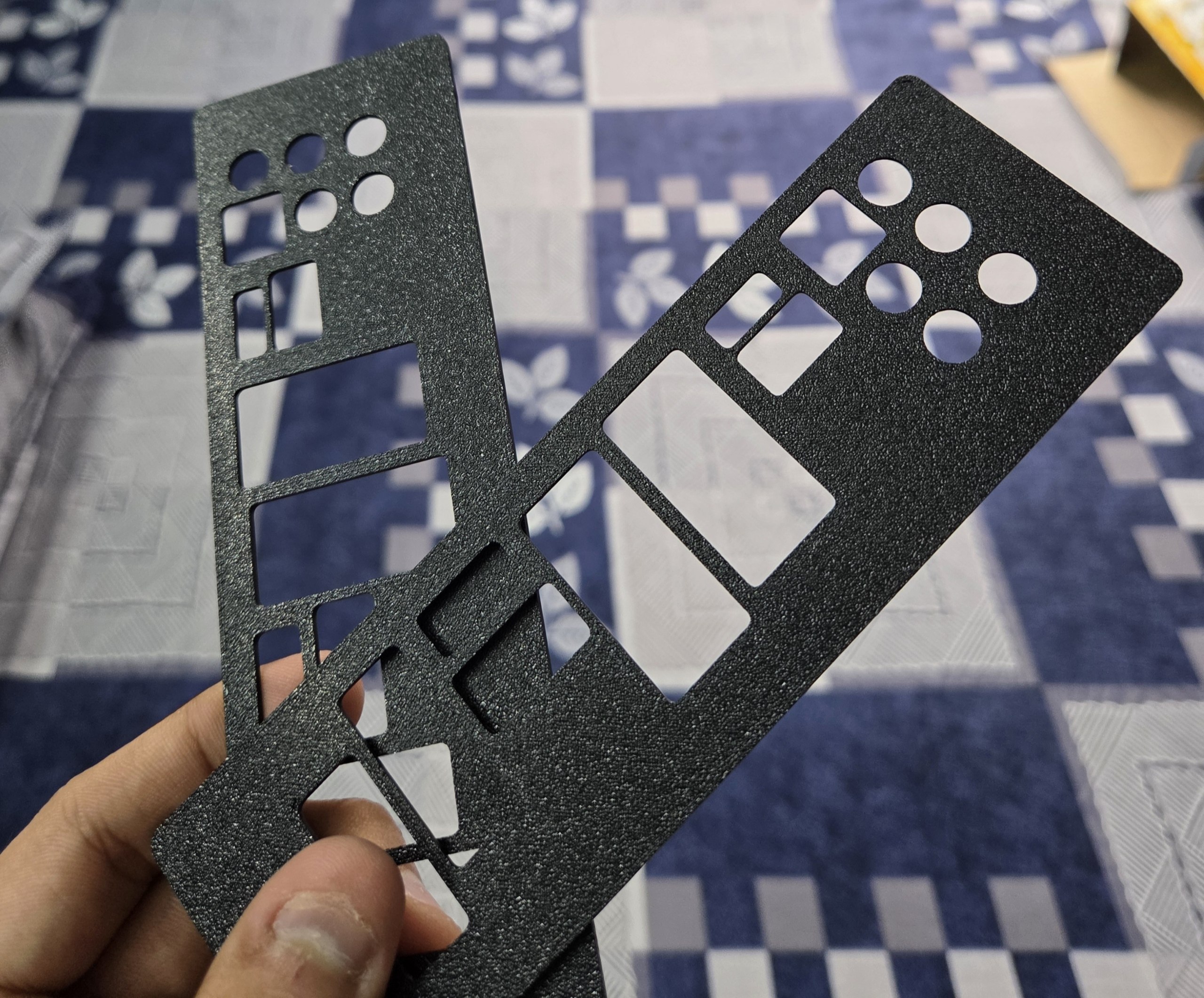 Custom designed I/O shields for a motherboard